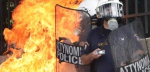 Riot police hit with molotov cocktail during nationwide strike over austerity measures in Athens